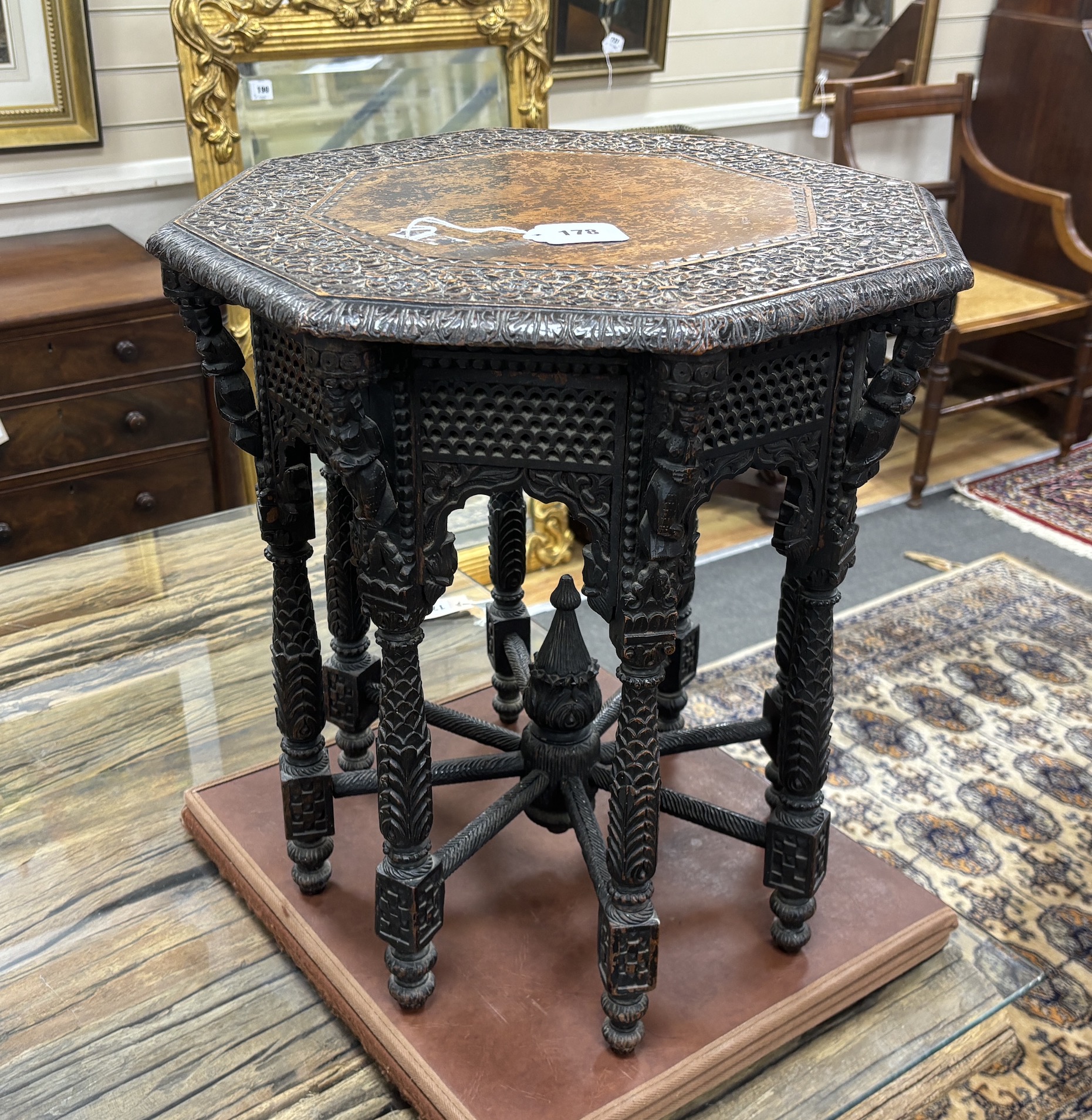 An Asian carved hardwood octagonal occasional table, width 49cm, height 49cm